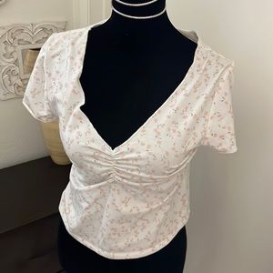 floral delicate top with rouched front.